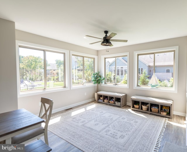 sunroom / solarium with ceiling fan