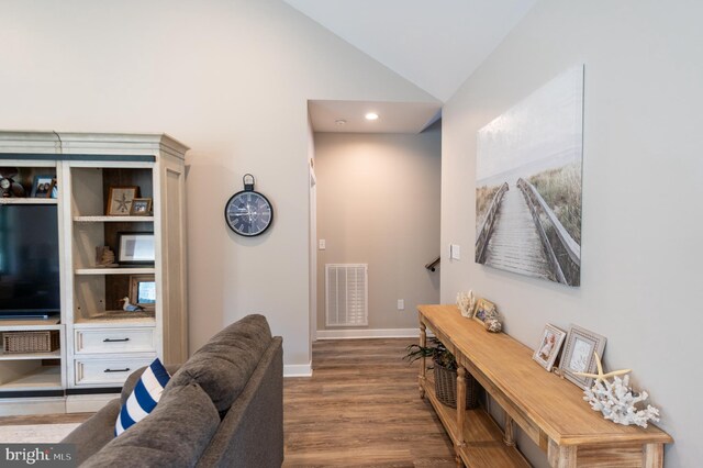 interior space featuring high vaulted ceiling and hardwood / wood-style flooring