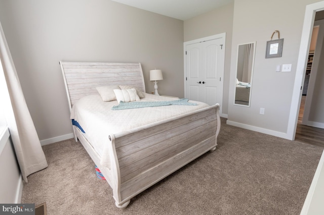 carpeted bedroom featuring a closet