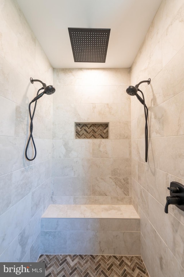 bathroom with a tile shower