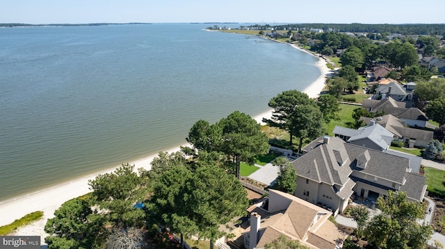 aerial view featuring a view of the beach and a water view