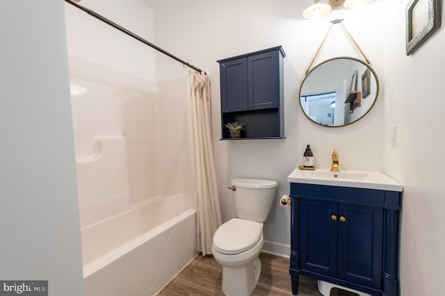 full bathroom featuring vanity, toilet, wood-type flooring, and shower / tub combo with curtain