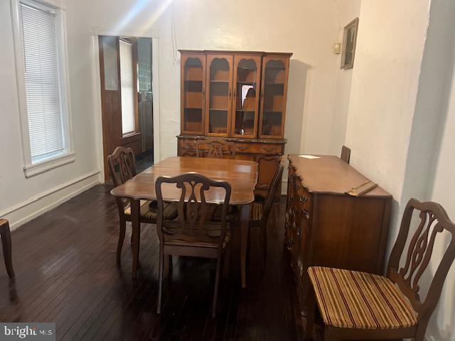 dining room featuring dark wood-type flooring