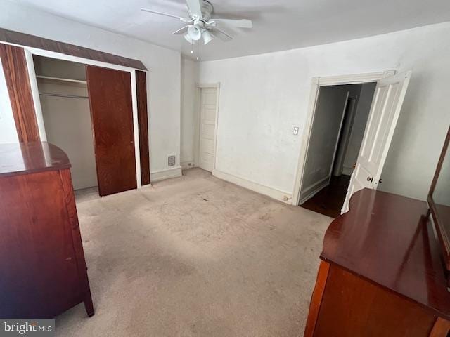 bedroom with ceiling fan and light colored carpet