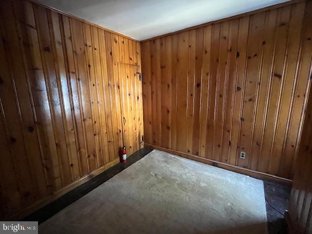 empty room with wood walls