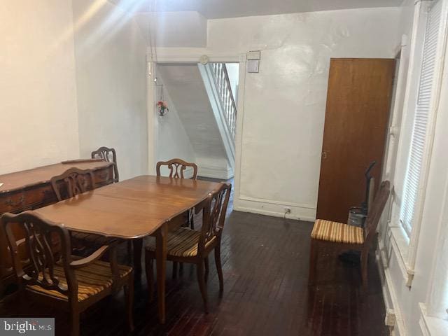 dining area with dark hardwood / wood-style floors