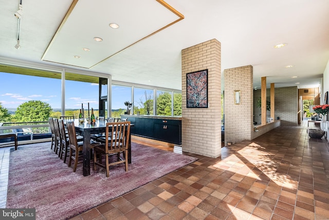 dining room with a wall of windows