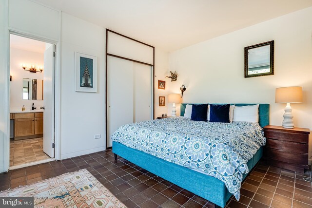 bedroom featuring ensuite bathroom