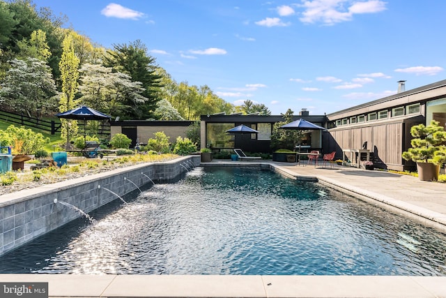 view of pool featuring a gazebo, pool water feature, and a patio area