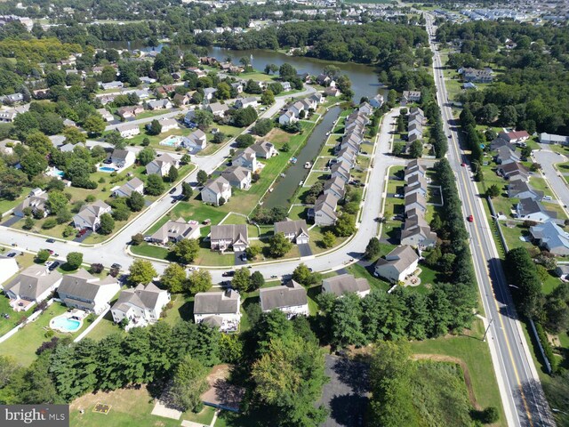 bird's eye view featuring a residential view and a water view