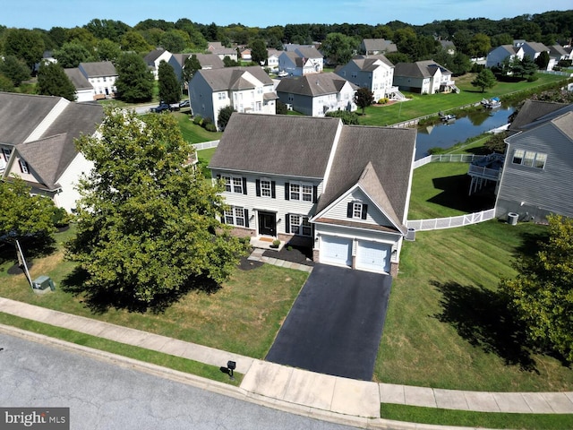 aerial view featuring a water view and a residential view