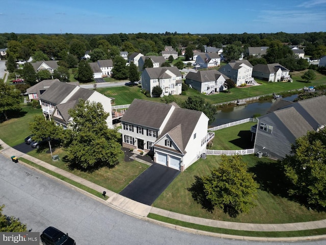 aerial view featuring a residential view and a water view