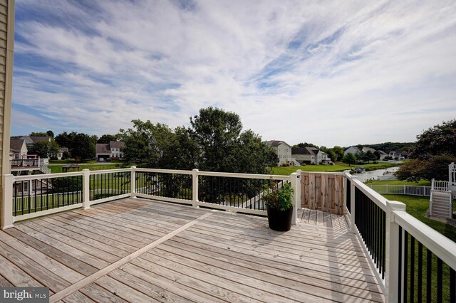 wooden deck with a residential view