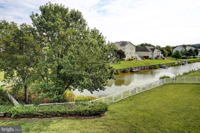 water view with fence and a residential view