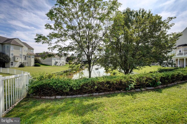 view of yard with a residential view and fence