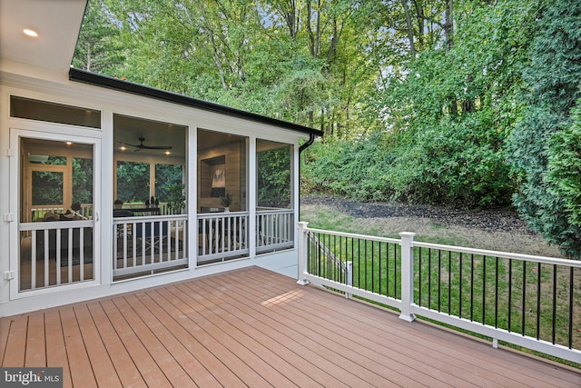 wooden deck featuring a sunroom