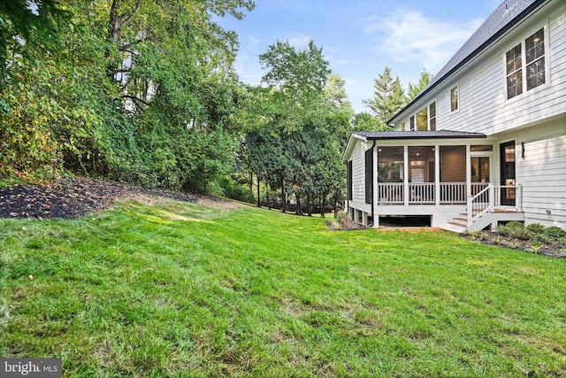 view of yard featuring a sunroom