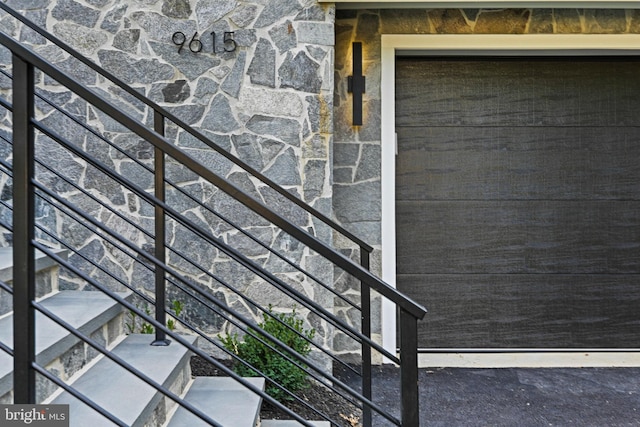 doorway to property with stone siding