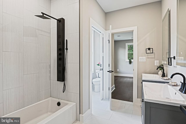 full bath featuring shower / bath combination, double vanity, toilet, tile patterned flooring, and a sink