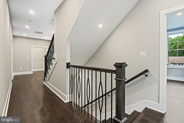 corridor with dark wood-type flooring