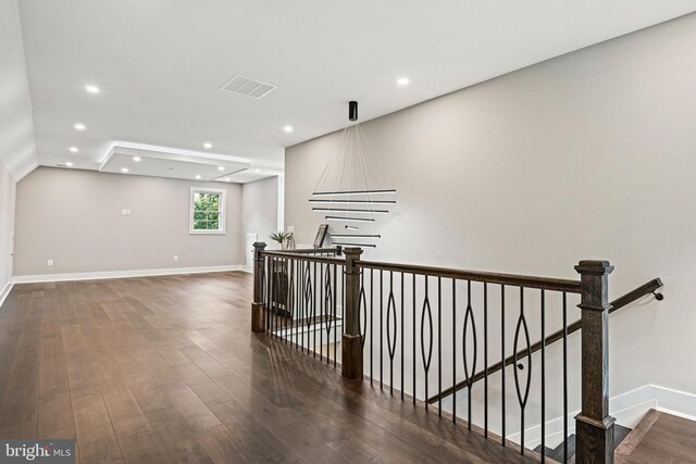 hallway with dark hardwood / wood-style flooring