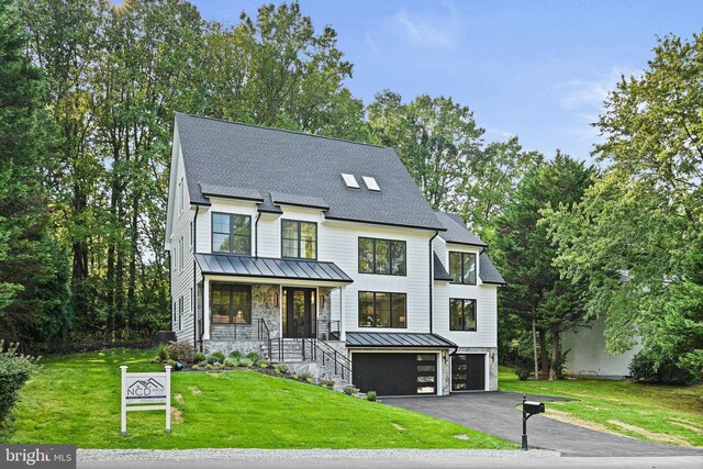 view of front of house with a garage and a lawn