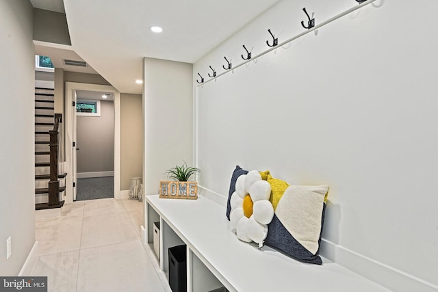 mudroom featuring light tile patterned floors, baseboards, visible vents, and recessed lighting