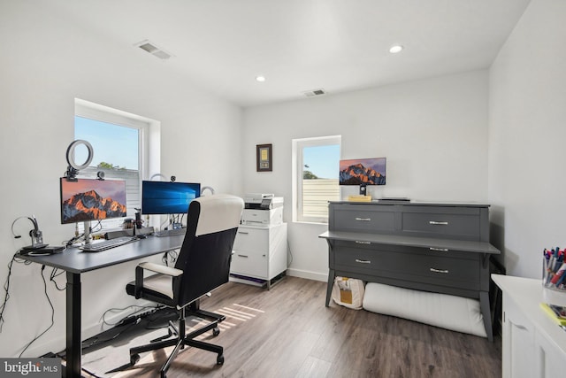 home office with baseboards, visible vents, wood finished floors, and recessed lighting