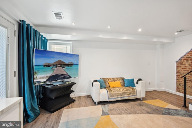 sitting room featuring recessed lighting, visible vents, and wood finished floors