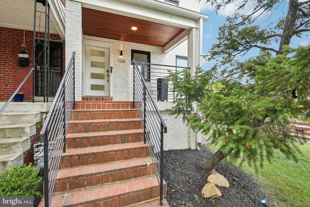 view of exterior entry featuring a porch