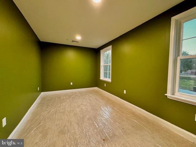 empty room with wood-type flooring