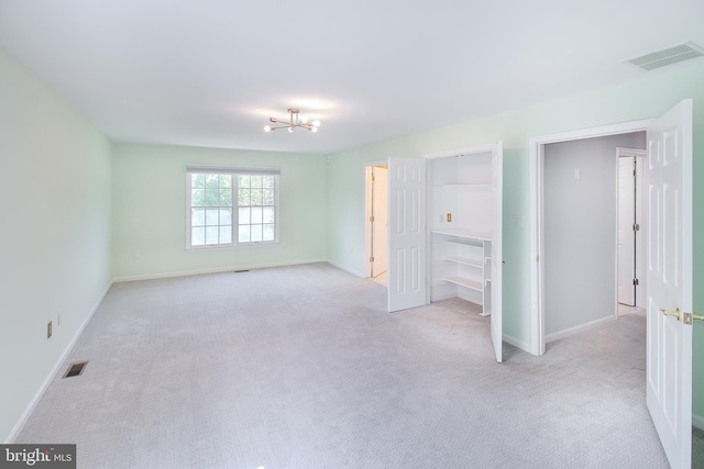 unfurnished bedroom featuring baseboards and visible vents