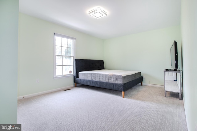 unfurnished bedroom with baseboards and carpet floors