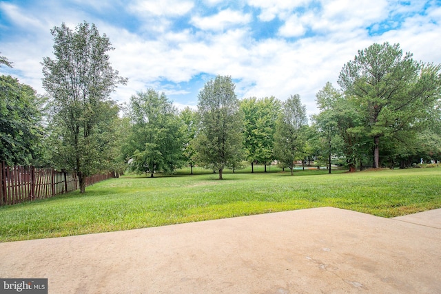 view of yard featuring a patio and fence