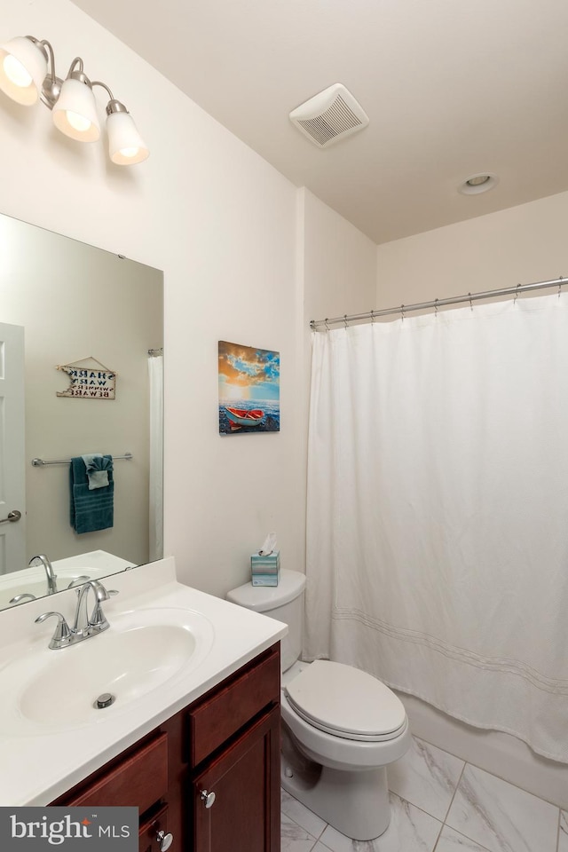 bathroom featuring walk in shower, toilet, and vanity