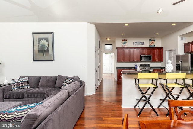 kitchen featuring appliances with stainless steel finishes and dark hardwood / wood-style floors