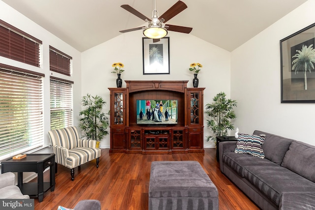 living room featuring ceiling fan, dark hardwood / wood-style flooring, and vaulted ceiling