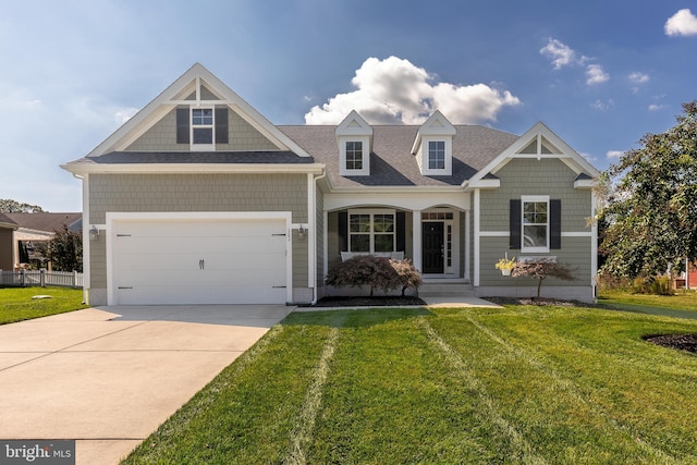 view of front facade featuring a garage, a porch, and a front lawn