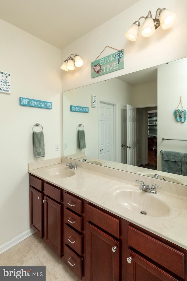 bathroom with tile patterned flooring and vanity