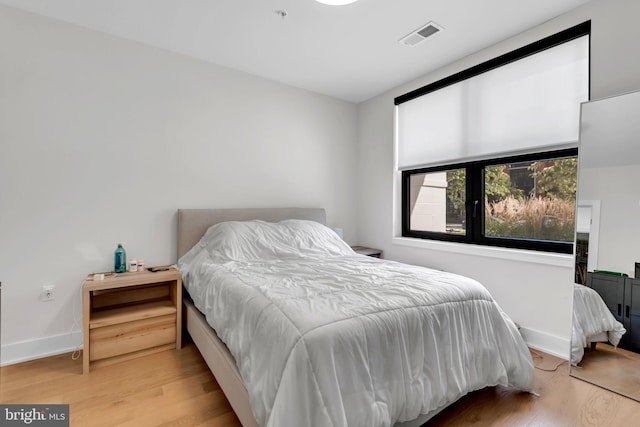 bedroom with light wood-type flooring