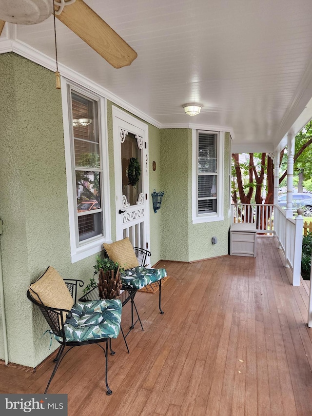 wooden terrace with a porch