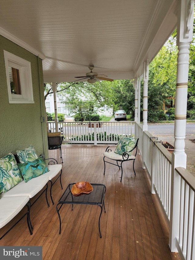 deck featuring ceiling fan and covered porch