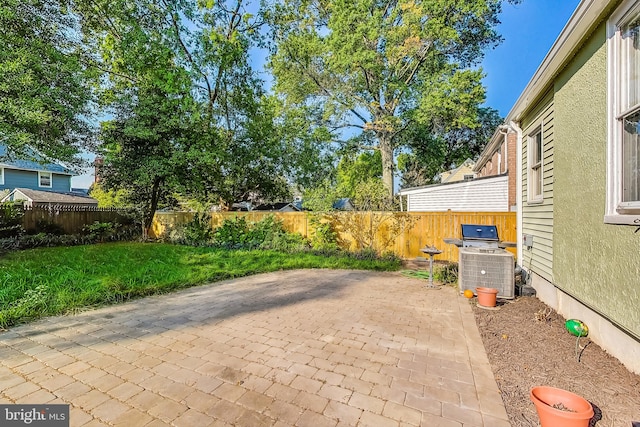 view of patio with grilling area and central air condition unit