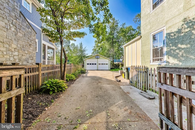 exterior space with an outdoor structure and a garage