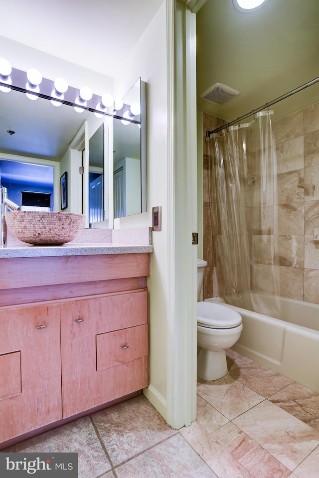 full bathroom with toilet, shower / bath combo, vanity, and visible vents