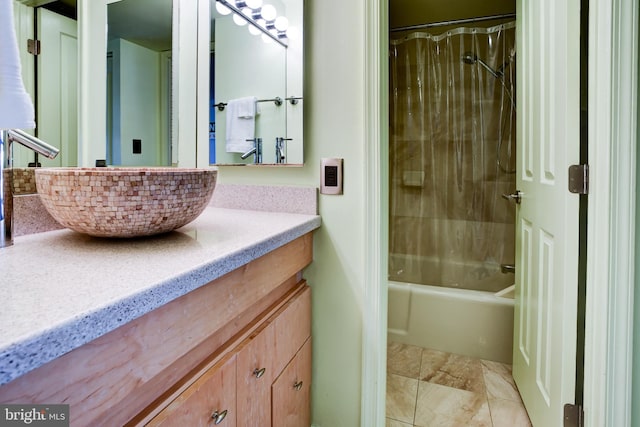 bathroom with shower / bath combo and vanity