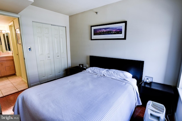 bedroom with a closet and wood finished floors