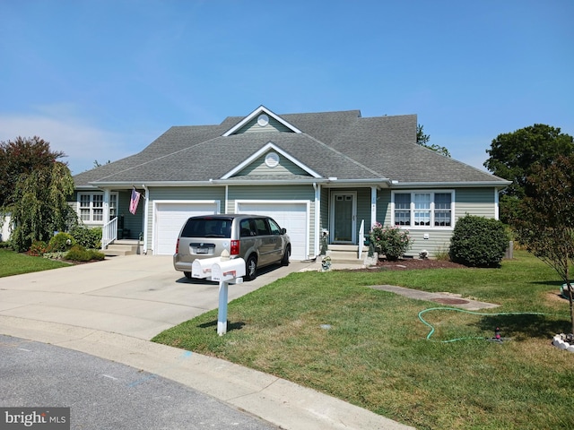 view of front of house featuring a garage and a front yard