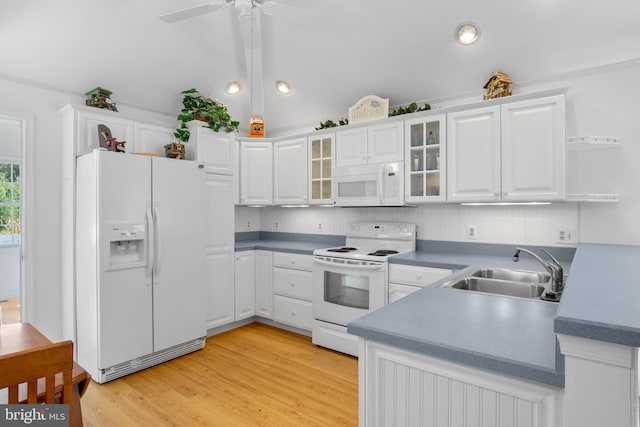 kitchen with white appliances, light hardwood / wood-style flooring, sink, white cabinetry, and ceiling fan