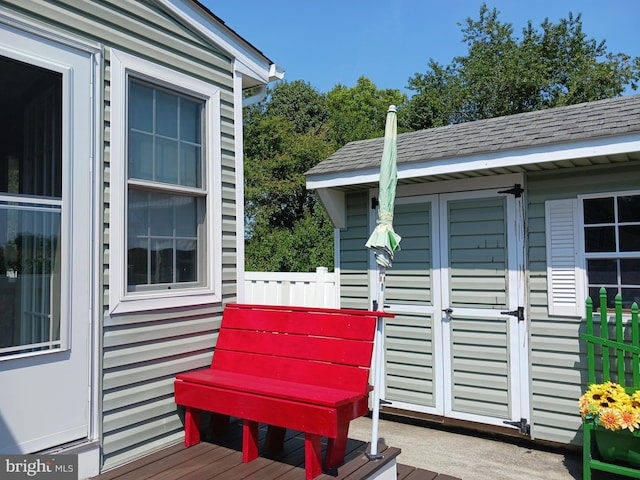 deck with a storage shed